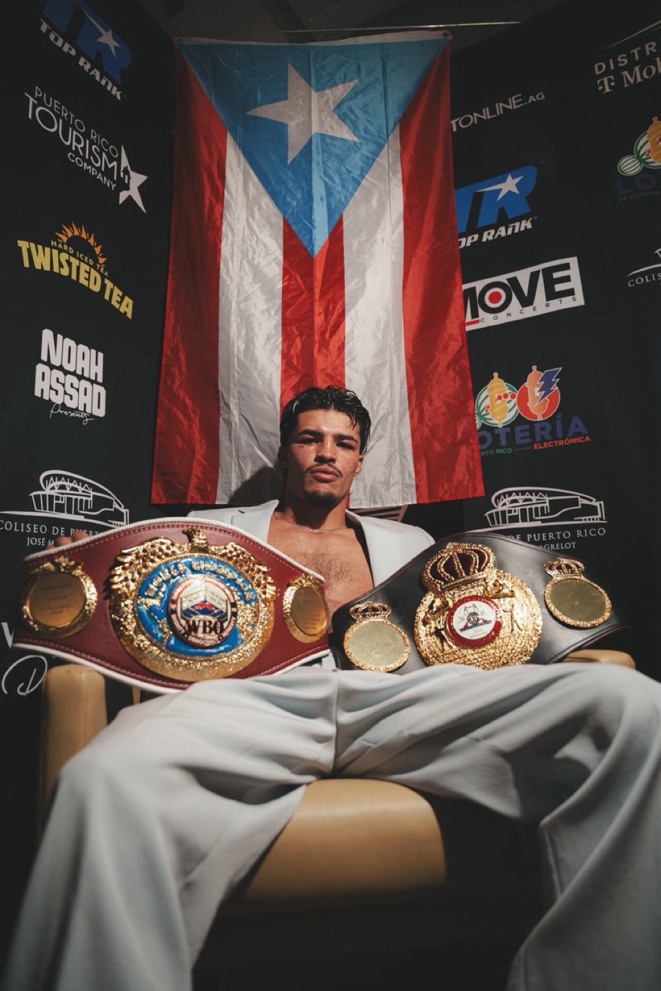 Zayas Unifies Titles in Split Decision